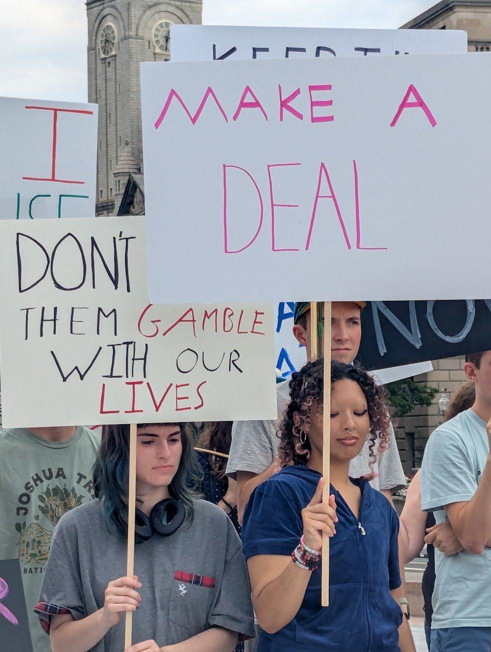 make a deal and dont let them gamble with our lives signs